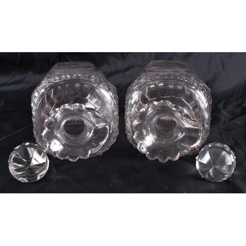 542 - A PAIR OF REGENCY CUT GLASS RUM AND WHISKEY DECANTERS. 22 cm high.