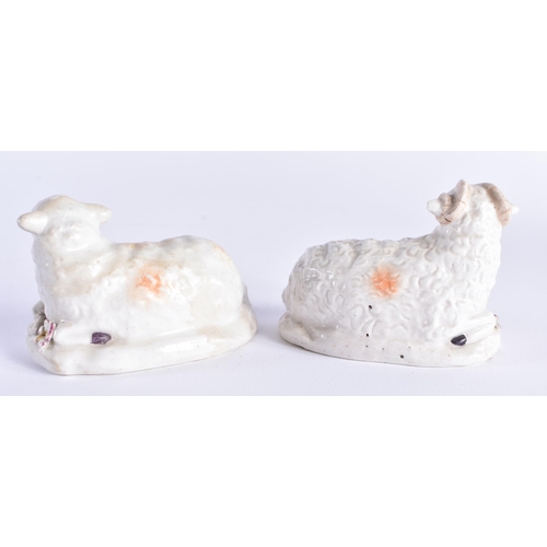 57 - A RARE PAIR OF 18TH CENTURY DERBY PORCELAIN SHEEP modelled recumbant. 8 cm wide.