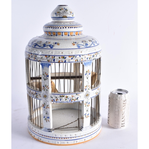 599 - A LARGE ITALIAN FAIENCE POTTERY BIRD CAGE. 38 cm high.