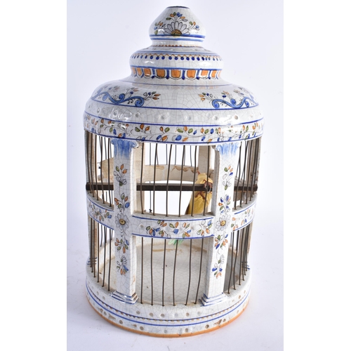 599 - A LARGE ITALIAN FAIENCE POTTERY BIRD CAGE. 38 cm high.