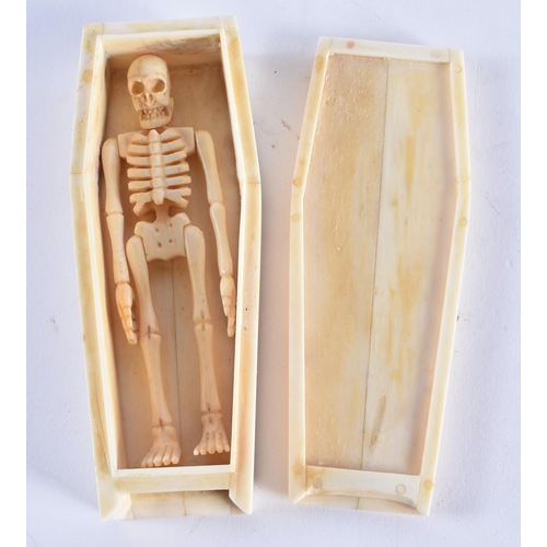 615 - A CONTINENTAL BONE SKELETON AND COFFIN. 137.6 grams. 11.5 cm x 4.5 cm.