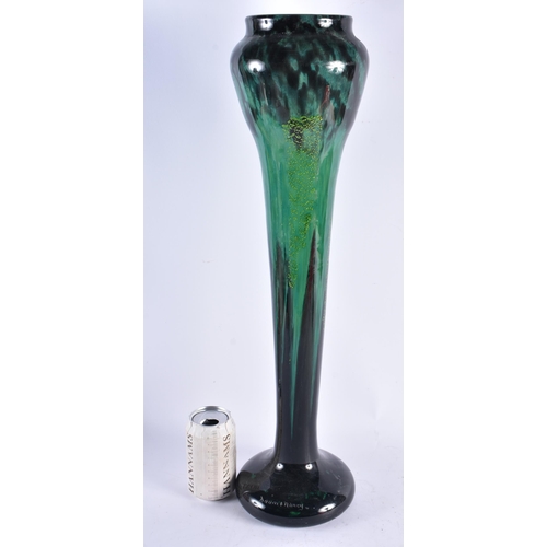 617 - A VERY LARGE FRENCH DAUM NANCY GREEN GLASS VASE of organic scrolling form. 59 cm high.