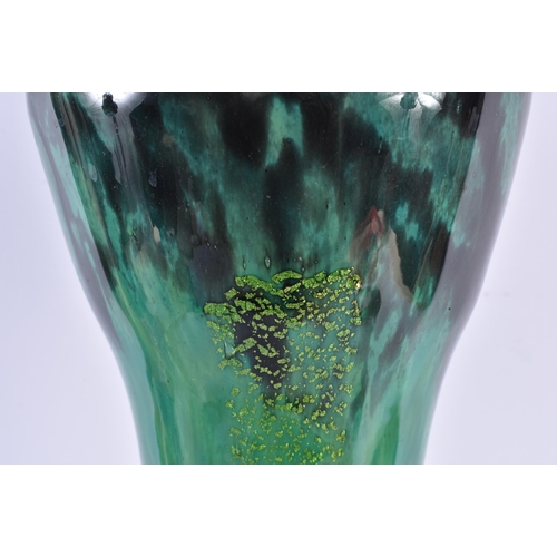 617 - A VERY LARGE FRENCH DAUM NANCY GREEN GLASS VASE of organic scrolling form. 59 cm high.