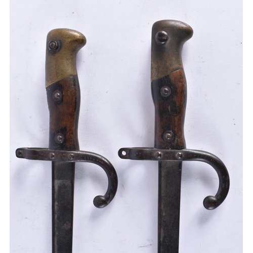 618 - TWO ANTIQUE MILITARY BAYONETS. 64 cm long. (2)