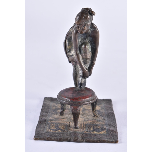 620 - AN AUSTRIAN COLD PAINTED BRONZE EROTIC BOTTOM REVEALING FEMALE FIGURE. 10.5 cm high.