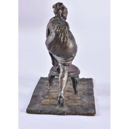 620 - AN AUSTRIAN COLD PAINTED BRONZE EROTIC BOTTOM REVEALING FEMALE FIGURE. 10.5 cm high.