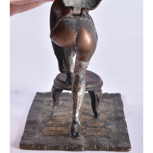 620 - AN AUSTRIAN COLD PAINTED BRONZE EROTIC BOTTOM REVEALING FEMALE FIGURE. 10.5 cm high.