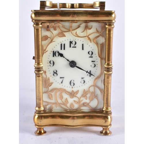 628 - AN ANTIQUE FRENCH ART NOUVEAU BRASS CARRIAGE CLOCK. 15 cm high inc handle.