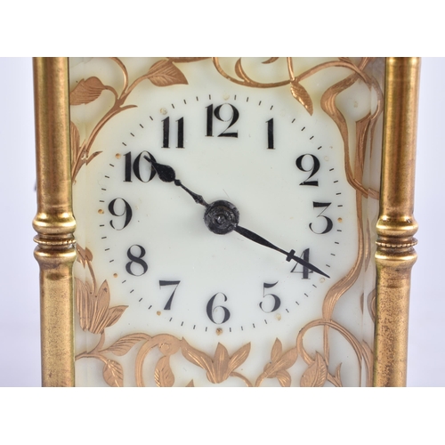 628 - AN ANTIQUE FRENCH ART NOUVEAU BRASS CARRIAGE CLOCK. 15 cm high inc handle.