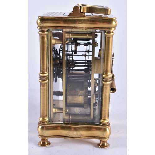 628 - AN ANTIQUE FRENCH ART NOUVEAU BRASS CARRIAGE CLOCK. 15 cm high inc handle.