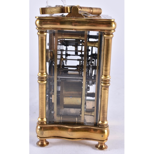 628 - AN ANTIQUE FRENCH ART NOUVEAU BRASS CARRIAGE CLOCK. 15 cm high inc handle.