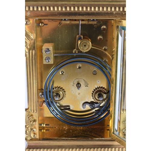 629 - A GOOD ANTIQUE FRENCH REPEATING BRONZE CARRIAGE CLOCK with painted enamel dial. 20 cm high inc handl... 