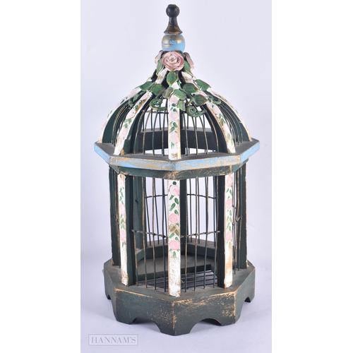 667 - A PAINTED WOOD BIRDCAGE. 38 cm high.