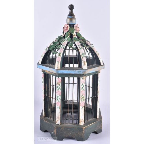 667 - A PAINTED WOOD BIRDCAGE. 38 cm high.