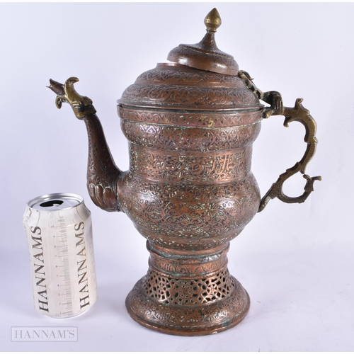 702 - AN ANTIQUE ISLAMC PERSIAN RETICULATED COPPER ALLOY EWER. 32 cm high.