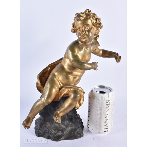 712 - A 19TH CENTURY FRENCH GILT BRONZE FIGURE OF A CHERUB. 31 cm high.