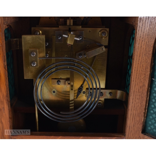 714 - AN ANTIQUE OAK BRACKET CLOCK with engraved foliate dial. 35 cm x 27 cm.