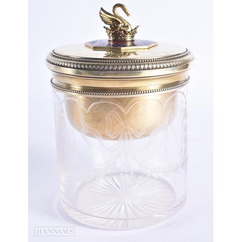 721 - A CONTINENTAL SILVER GILT AND ENAMEL CUT GLASS BOX AND COVER. 14 cm high.