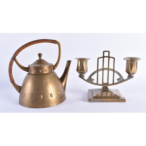 75 - A LATE 19TH CENTURY SECCIONIST MOVEMENT BRASS KETTLE together with a similar candlestick. Largest 18... 