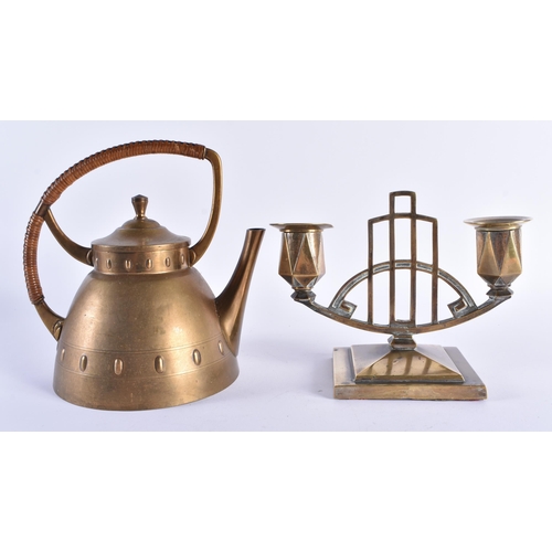 75 - A LATE 19TH CENTURY SECCIONIST MOVEMENT BRASS KETTLE together with a similar candlestick. Largest 18... 