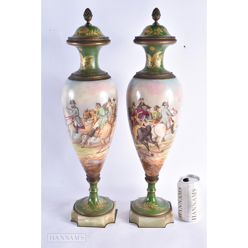 754 - A GOOD PAIR OF 19TH CENTURY FRENCH SEVRES PORCELAIN VASES AND COVERS painted with battle scenes. 52 ... 