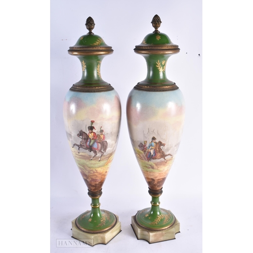 754 - A GOOD PAIR OF 19TH CENTURY FRENCH SEVRES PORCELAIN VASES AND COVERS painted with battle scenes. 52 ... 