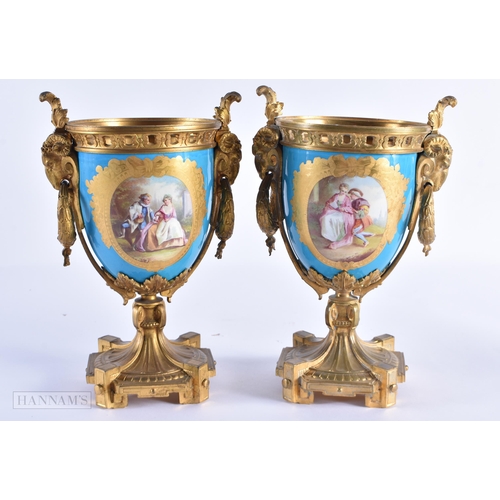 762 - A PAIR OF 19TH CENTURY FRENCH SEVRES PORCELAIN VASES painted with figures in a landscape. 23 cm high... 