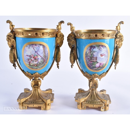 762 - A PAIR OF 19TH CENTURY FRENCH SEVRES PORCELAIN VASES painted with figures in a landscape. 23 cm high... 