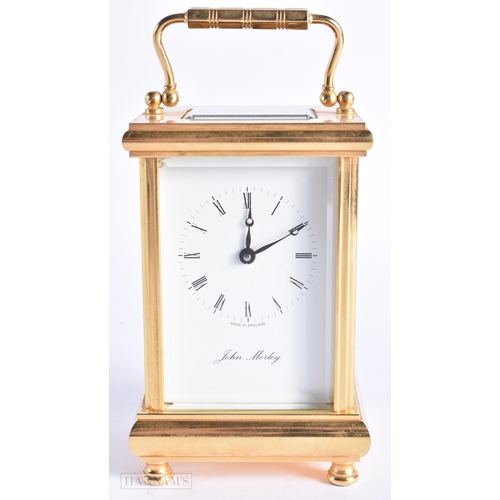 773 - John Morley Brass Carriage Clock. 15 cm high inc handle.