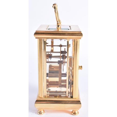 773 - John Morley Brass Carriage Clock. 15 cm high inc handle.