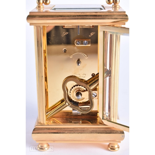 773 - John Morley Brass Carriage Clock. 15 cm high inc handle.