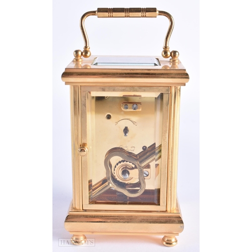 773 - John Morley Brass Carriage Clock. 15 cm high inc handle.