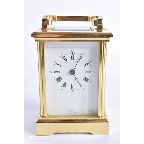 776 - A BRASS CARRIAGE CLOCK. 15 cm high inc handle.