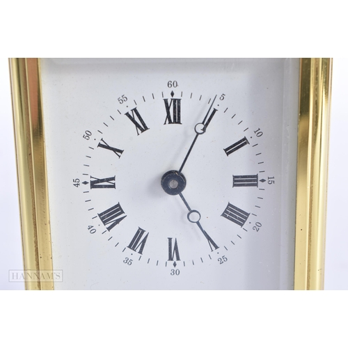 776 - A BRASS CARRIAGE CLOCK. 15 cm high inc handle.