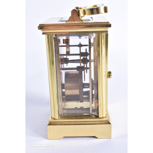 776 - A BRASS CARRIAGE CLOCK. 15 cm high inc handle.