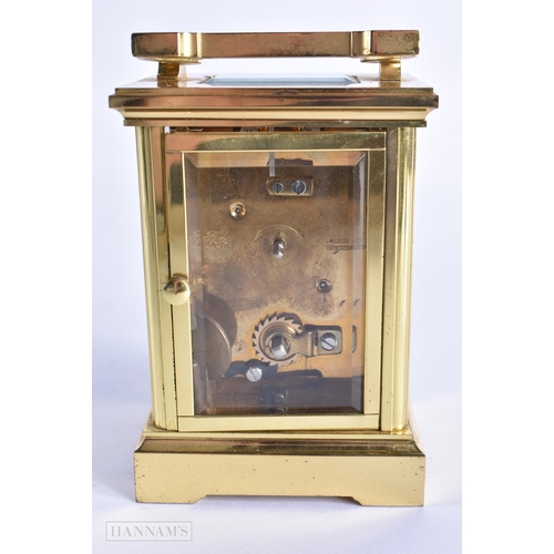 776 - A BRASS CARRIAGE CLOCK. 15 cm high inc handle.