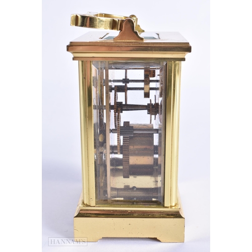 776 - A BRASS CARRIAGE CLOCK. 15 cm high inc handle.