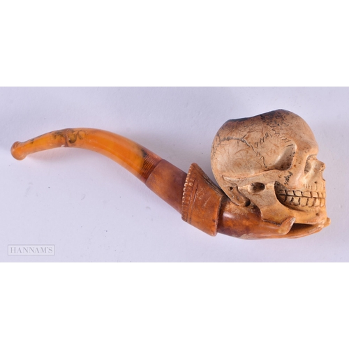 790 - AN ANTIQUE SKULL MEERSCHAUM PIPE. 14 cm long.