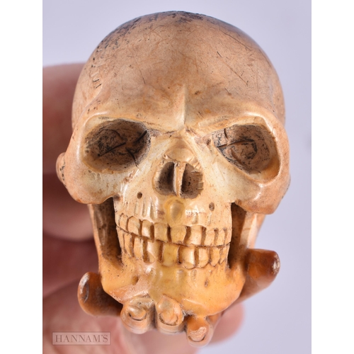 790 - AN ANTIQUE SKULL MEERSCHAUM PIPE. 14 cm long.