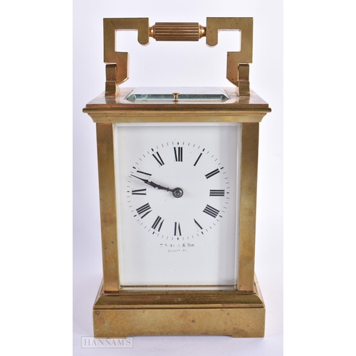 795 - AN ANTIQUE FRENCH BRASS CARRIAGE CLOCK. 18 cm high inc handle.