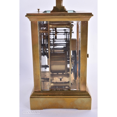 795 - AN ANTIQUE FRENCH BRASS CARRIAGE CLOCK. 18 cm high inc handle.