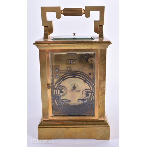 795 - AN ANTIQUE FRENCH BRASS CARRIAGE CLOCK. 18 cm high inc handle.