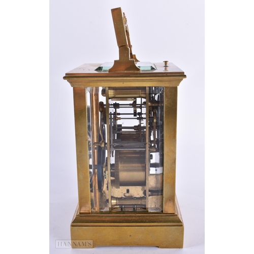 795 - AN ANTIQUE FRENCH BRASS CARRIAGE CLOCK. 18 cm high inc handle.