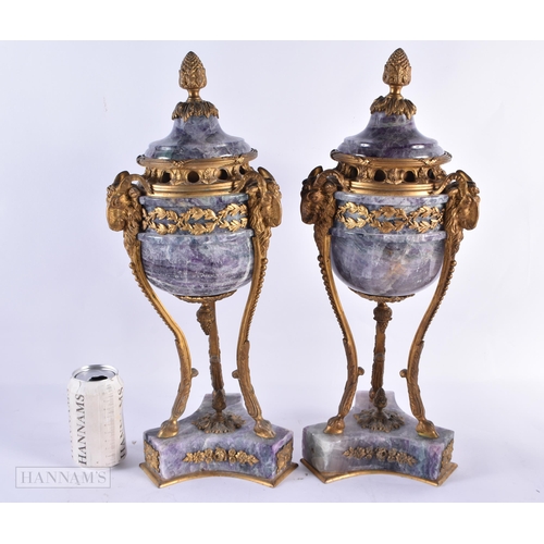 798 - A LARGE PAIR OF LATE 19TH CENTURY FRENCH MOUNTED STONE URNS AND COVERS possibly Bluejohn. 47 cm high... 