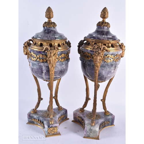 798 - A LARGE PAIR OF LATE 19TH CENTURY FRENCH MOUNTED STONE URNS AND COVERS possibly Bluejohn. 47 cm high... 