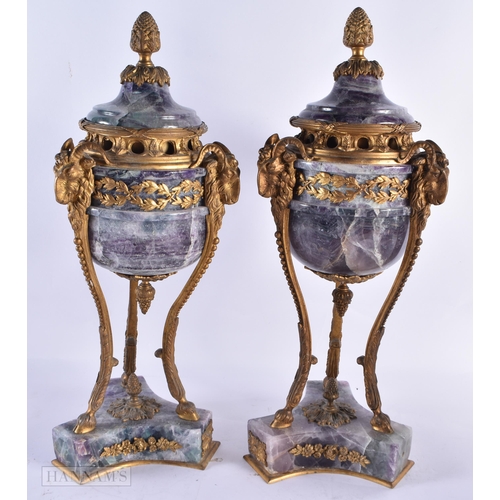 798 - A LARGE PAIR OF LATE 19TH CENTURY FRENCH MOUNTED STONE URNS AND COVERS possibly Bluejohn. 47 cm high... 