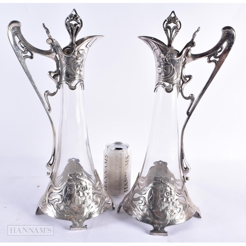 801 - A LOVELY PAIR OF ART NOUVEAU PEWTER WMF CLARET JUGS. 40 cm high.