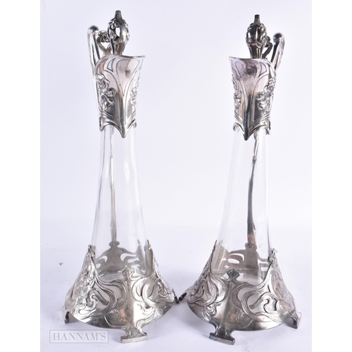 801 - A LOVELY PAIR OF ART NOUVEAU PEWTER WMF CLARET JUGS. 40 cm high.