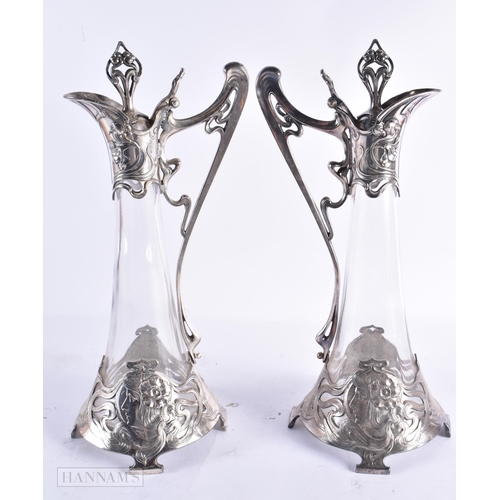 801 - A LOVELY PAIR OF ART NOUVEAU PEWTER WMF CLARET JUGS. 40 cm high.