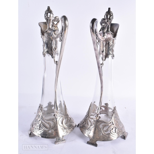 801 - A LOVELY PAIR OF ART NOUVEAU PEWTER WMF CLARET JUGS. 40 cm high.